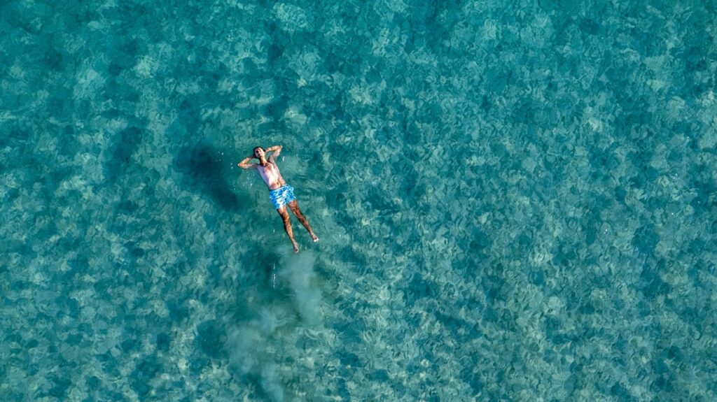 man-swimming-in-swimming-pool-12778449 Man Swimming in Swimming Pool